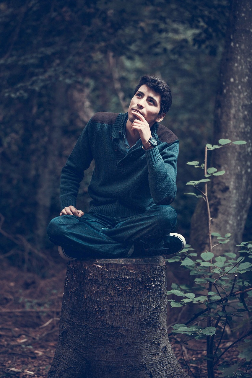 man thinking in forest